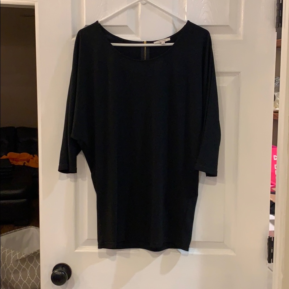 Black blouse with gold zipper in back